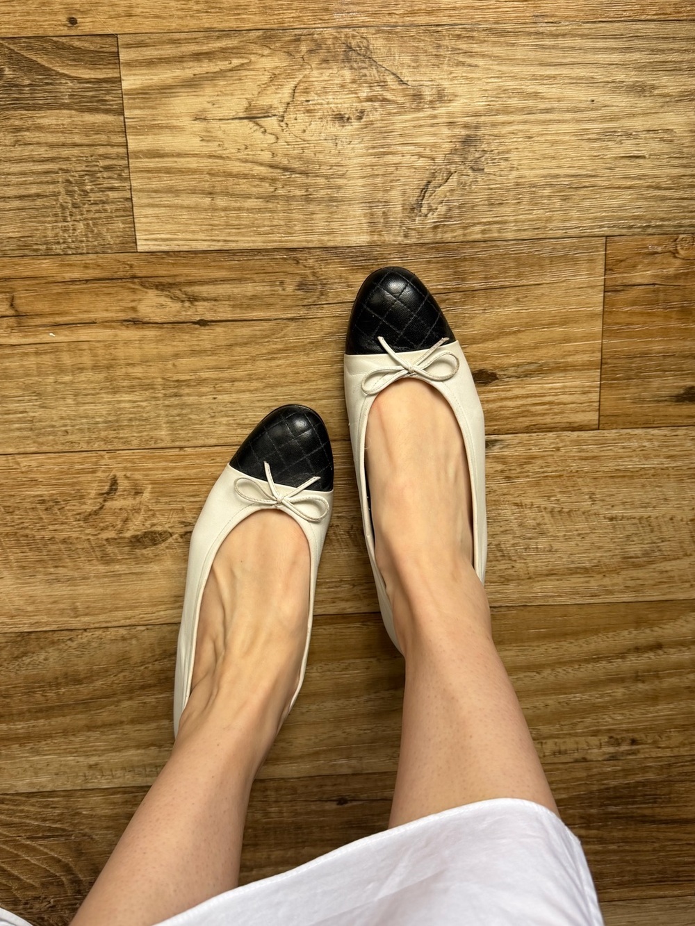 Delman Women’s Two-Tone Black and Cream Ballet Flats